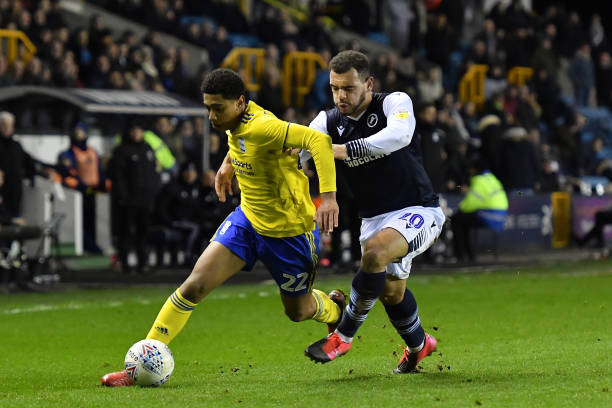 Jude Bellingham competing with Mason Bennett during Millwall vs Birmingham City in the Championship